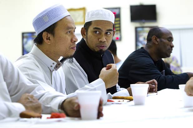 Abdula Aye, left, and Abdul Ghani, resident imams from Thailand, break the day's fast on the 27th day of Ramadan at the Jamia Masjid mosque Wednesday, Aug. 15, 2012. During the month of Ramadan, muslims fast from dawn until sunset.