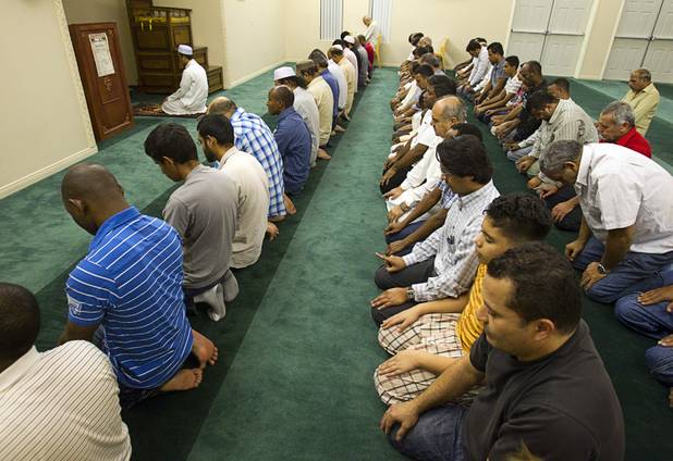 Abdula Aye, top right, a resident imam from Thailand, leads men in prayers on the 27th day of Ramadan at the Jamia Masjid mosque, Wednesday, Aug. 15, 2012.