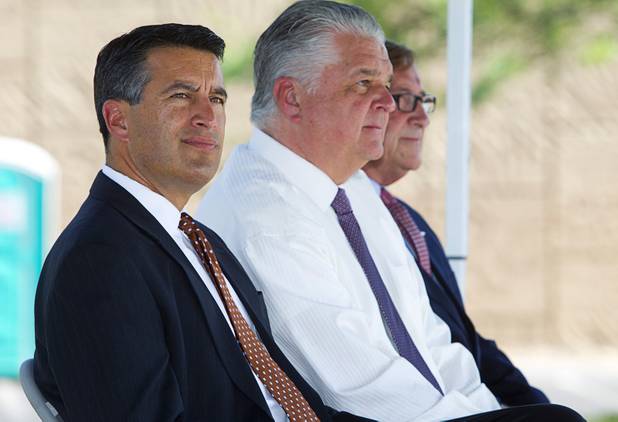 Nevada Governor Brian Sandoval, left, Clark County Commissioner Steve Sisolak, center, and Rossi Ralenkotter, president/CEO of the Las Convention and Visitors Authority, attend a ceremony to celebrate the "grand opening" of the I-15 South Design-Build Project in the Town Square parking lot Wednesday, Aug. 15, 2012. Construction on  $246 million improvement project started in Spring 2010.