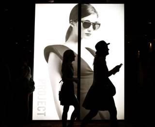 Attendees walk past a sign for the PROJECT show inside the Mandalay Bay Convention Center on Monday, August 20, 2012. PROJECT is part of the fashion trade show MAGIC.