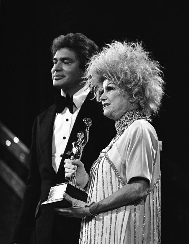 In this file photo provided by the Las Vegas News Bureau, comedian Phyllis Diller is on stage with singer Engelbert Humperdinck during the American Guild of Variety Artists (AGVA) at Caesars Palace in Las Vegas. 1-8-78.  She died on Monday, Aug. 20, 2012 at age 95.