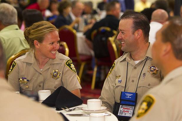 Metro Police Officer Booke Lavin, left, chats with Officer Jeremy Levy before receiving the award for Crisis Intervention Team (CIT) Officer of the Year during a CIT International awards luncheon at the South Point Tuesday, Aug. 21, 2012.  Lavin was honored with the award after calming a suicidal man and then following up to make sure the man received a variety of social services. Levy was CIT Officer of the Year in 2006.