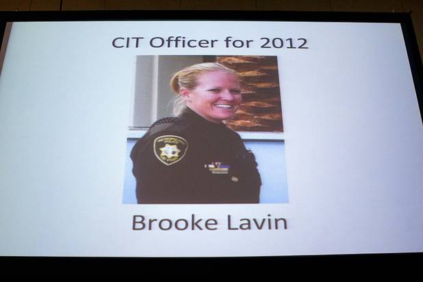 A photo of Metro Police Officer Booke Lavin is shown on a screen as she is announced as Crisis Intervention Team (CIT) Officer of the Year during a CIT International awards luncheon at the South Point Tuesday, Aug. 21, 2012.  Lavin was honored with the award after calming a suicidal man and then following up to make sure the man received a variety of social services.