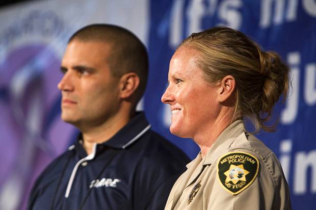 Metro Police Officer Booke Lavin, right, waits on stage with Sgt. Andy Suvada, of Streetsboro, Ohio, 2011 CIT Officer of the Year, during a CIT International awards luncheon at the South Point Tuesday, Aug. 21, 2012.  Lavin was honored with the award for the award for Crisis Intervention Team (CIT) Officer of the Year after calming a suicidal man and then following up to make sure the man received a variety of social services.