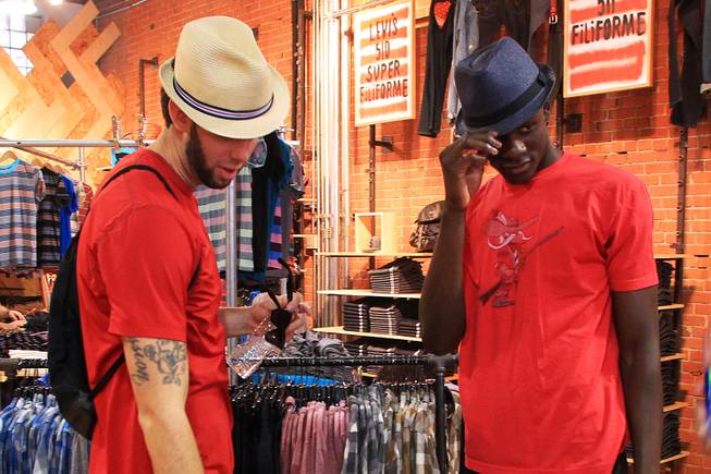 UNLV's Carlos Lopez and Demetris Morant check out some hats while shopping in Montreal as the do some sightseeing before their game against McGill University Tuesday, August 21, 2012.