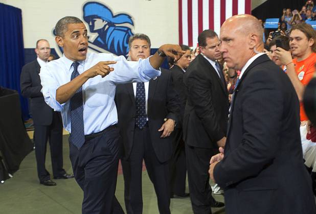 President Barack Obama heads to the stage as he arrives for a rally at Canyon Springs High School in North Las Vegas Wednesday, Aug. 22, 2012.