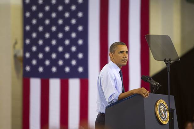 President Barack Obama pauses during a rally at Canyon Springs High School in North Las Vegas Wednesday, Aug. 22, 2012.