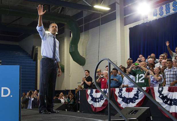 President Barack Obama waves after speaking at a rally at Canyon Springs High School in North Las Vegas Wednesday, Aug. 22, 2012.