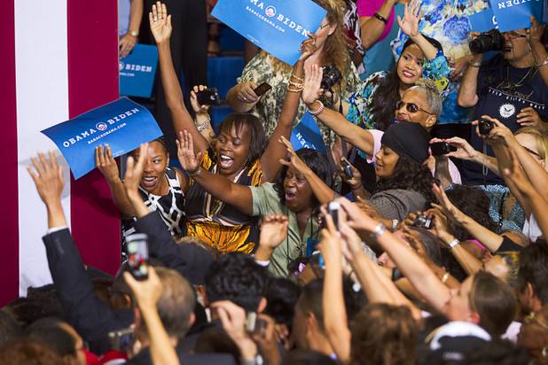 Supporters reach out to President Barack Obama as he leaves a rally at Canyon Springs High School in North Las Vegas Wednesday, Aug. 22, 2012.