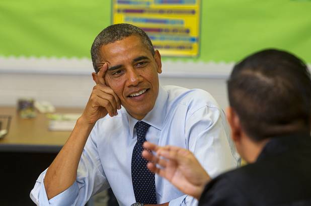 President Barack Obama listens to Clark County teachers Isaac Barron, a government and world history teacher at Rancho High School, during a roundtable discussion on K-12 education at Canyon Springs High School in North Las Vegas Wednesday, Aug. 22, 2012.