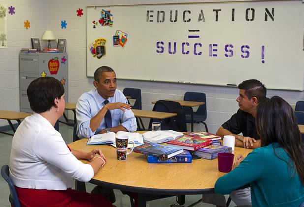 President Barack Obama holds a roundtable to discuss K-12 education with Clark County teachers Lori Elizabeth Henrickson, left, Isaac Barron and Claritssa Sanchez, at Canyon Springs High School in North Las Vegas Wednesday, Aug. 22, 2012.