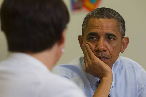 President Barack Obama listens to Lori Elizabeth Henrickson, an earth science teacher at Del Webb Middle School, during a roundtable discussion on K-12 education at Canyon Springs High School in North Las Vegas Wednesday, Aug. 22, 2012.