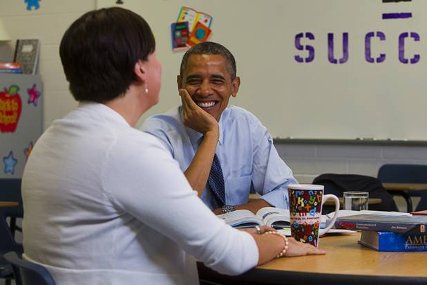 President Barack Obama listens to Lori Elizabeth Henrickson, an earth science teacher at Del Webb Middle School, during a roundtable discussion on K-12 education at Canyon Springs High School in North Las Vegas Wednesday, Aug. 22, 2012.