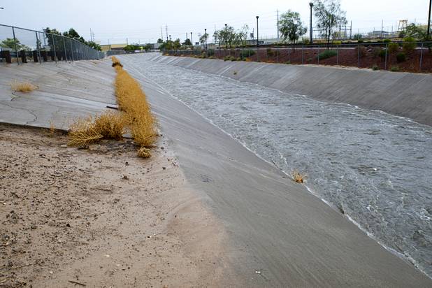 Storm run off flows through a flood channel in North Las Vegas Wednesday, Aug. 22, 2012.