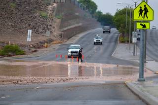 A Henderson police officer blocks the eastbound roadway of Sunridge Heights Parkway between Seven Hills Drive and Coronado Center in Henderson Wednesday, August 22, 2012.