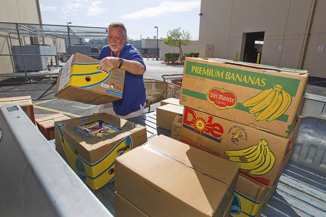 Tony Voggetzer of Sunrise Baptist Church loads food into a pick-up truck at the Three Square Food Bank Thursday, Aug. 23, 2012. The church's food pantry, which started in a deacon's closet, has already distributed 672,308 lbs. of food this year, according to Three Square records.