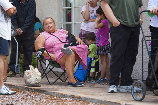 Connie Diemoz waits in line for food assistance at Sunrise Baptist Church, 1780 Betty Lane, Thursday, Aug. 23, 2012.