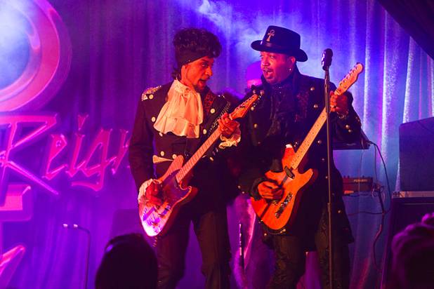 Prince impersonator Jason Tenner performs with guitarist D'Andre in The ...