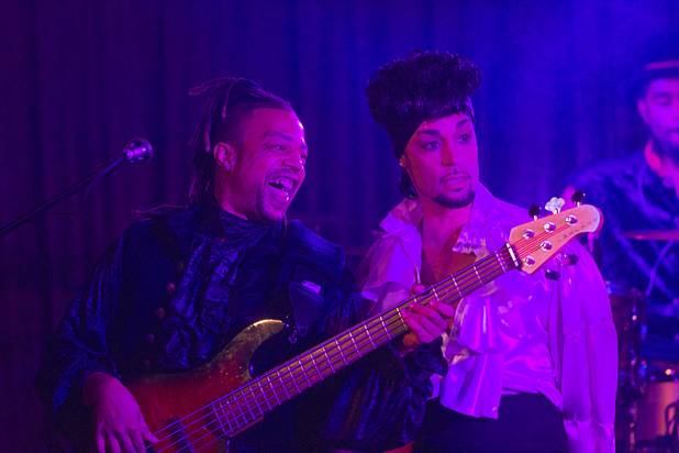 Prince impersonator Jason Tenner, right, performs with bassist Andre Brunson ...