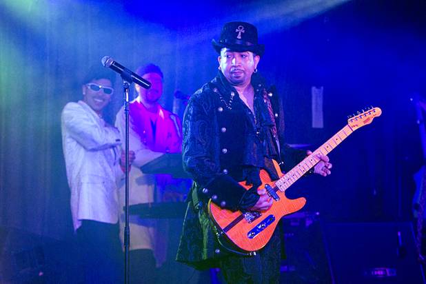 Guitarist D'Andre performs with Purple Reign in The D showroom in downtown Las Vegas Sunday, Aug. 26, 2012.