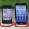 Apple's iPhone 4S, left, and Samsung Electronics' Galaxy S III are displayed at a mobile phone shop in Seoul, South Korea, on Friday, Aug. 24, 2012. 