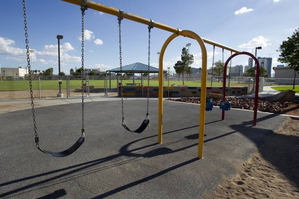 A swing set at Baker Park on St. Louis Avenue near 10th Street Sunday, Aug. 26, 2012. STEVE MARCUS