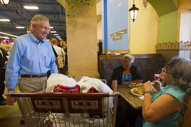 Senate Majority Leader Harry Reid visits with Sylvia Curtis, left, and Georgette Psaraki in the food court of the Cardenas  Market Meadows Lane and Decatur Boulevard Monday, Aug. 27, 2012.