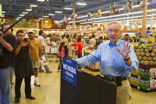 Senate Majority Leader Harry Reid responds to a question about Mitt Romney's tax returns following a tour of the Cardenas  Market at Meadows Lane and Decatur Boulevard Monday, Aug. 27, 2012.