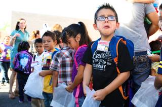 Kindergartner Jonathan Mondragon sobs while standing in line on the playground prior to the first day of class Monday, August 27, 2012, at Cambeiro Elementary School in Las Vegas.