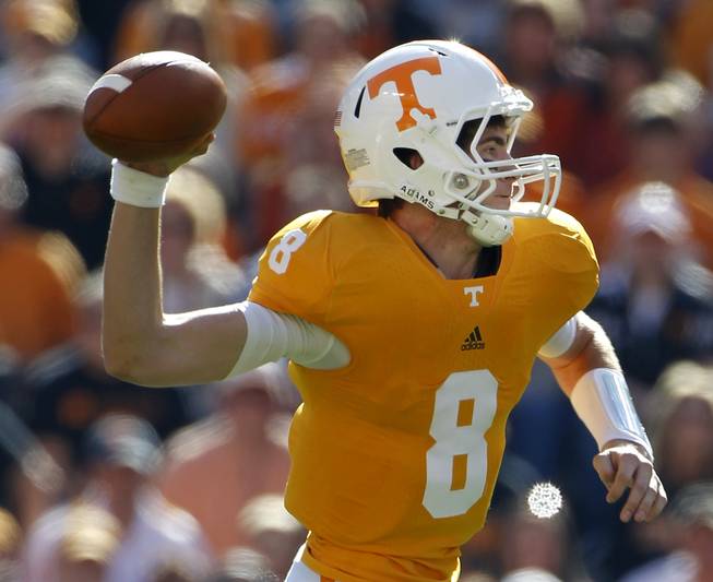 Tennessee quarterback Tyler Bray (8) passes in the first quarter of an NCAA college football game against Mississippi on Saturday, Nov. 13, 2010 in Knoxville, Tenn. Bray passed for 323 yards and three touchdowns as Tennessee won 52-14.