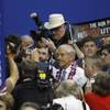 Rep. Ron Paul, R-Texas, arrives on the convention floor for the Republican National Convention in Tampa, Fla., on Tuesday, Aug. 28, 2012. 