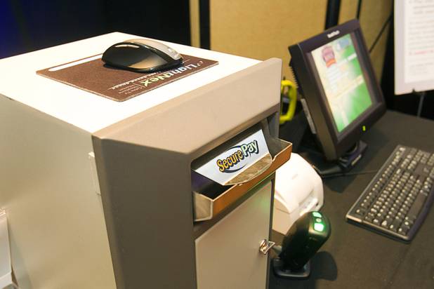 A United Coin Machine Company SecurePay machine is displayed during a news conference at the Orleans Wednesday, Aug. 29, 2012. United Coin, one of the state's largest independent route operators, unveiled SmartVend, a cash management system for local operators.