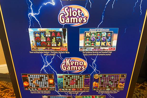 A banner showcases new games by United Coin Machine Company during a news conference at the Orleans Wednesday, Aug. 29, 2012. United Coin, one of the state's largest independent route operators, unveiled a new PowerVision multi-game that will be only available at restricted license locations serviced by United Coin.