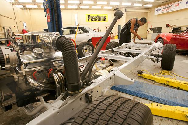 Julien Fontenot, a senior at the Southeast Career and Technical Academy in Henderson, works on a 1957 Chevrolet pick-up truck during a auto repair class at the school Wednesday, Aug. 29, 2012.