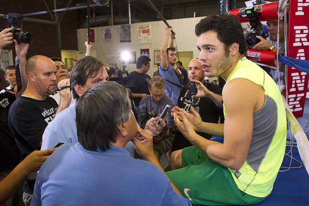 WBC middleweight champion Julio Cesar Chavez Jr., son of boxing legend Julio Cesar Chavez, prepares for interviews at Top Rank Gym Thursday, Aug. 30, 2012, Chavez will defend his title against Sergio Martinez of Argentina at the Thomas & Mack Center Sept. 15.