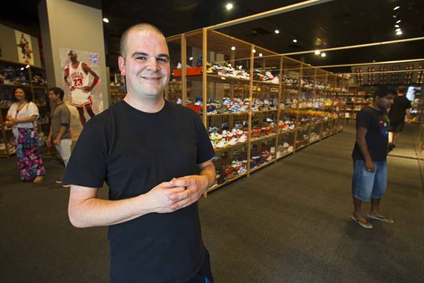 Shoe collector Jordan Michael Geller poses during the grand opening of the ShoeZeum at the Neonopolis mall in downtown Las Vegas Thursday, Aug. 30, 2012. The collection has 2,500 pairs of new Nike shoes.
