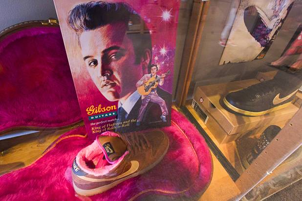 A Nike shoe with a Gibson Guitar/Elvis theme is displayed during the grand opening of the ShoeZeum at the Neonopolis mall in downtown Las Vegas Thursday, Aug. 30, 2012. The collection has 2,500 pairs of new Nike shoes.