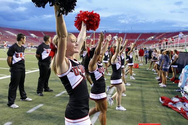 UNLV cheerleaders practice before UNLV's season opener against Minnesota at Sam Boyd Stadium Thursday, Aug. 30, 2012.