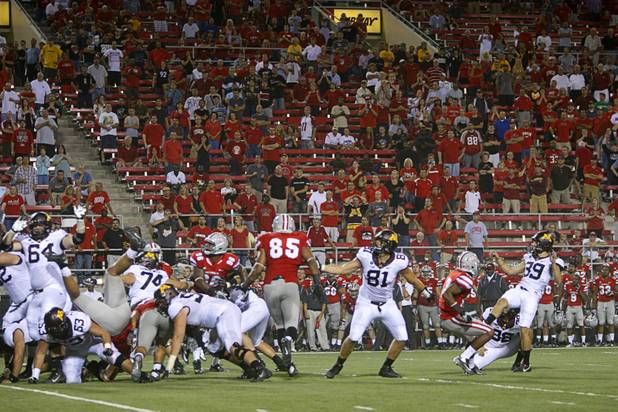 Minnesota kicker Jordan Wettstein, right, makes the winning field goal in the third overtime period to beat UNLV in their season opener at Sam Boyd Stadium Thursday, Aug. 30, 2012.