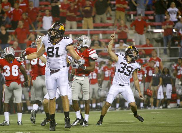 Minnesota kicker Jordan Wettstein, right, celebrates after making the winning field goal in the third overtime period to beat UNLV in their season opener at Sam Boyd Stadium Thursday, Aug. 30, 2012.