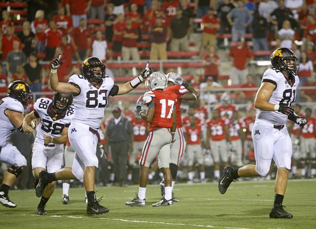 Minnesota players celebrate after beating UNLV with a field goal in the third overtime period at Sam Boyd Stadium Thursday, Aug. 30, 2012.