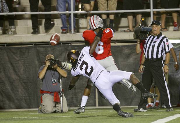 Minnesota's Troy Stoudermire is called for pass interference as he covers UNLV's Anthony Williams during UNLV's season opener against Minnesota at Sam Boyd Stadium Thursday, Aug. 30, 2012.