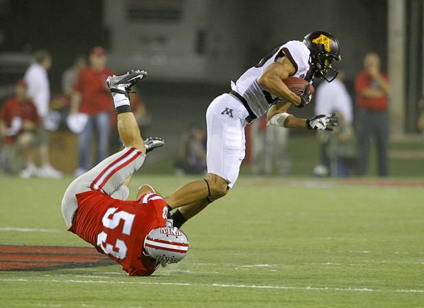 UNLV's Max Ehlert makes a diving tackle on Devin Crawford-Tufts during UNLV's season opener against Minnesota at Sam Boyd Stadium Thursday, Aug. 30, 2012.