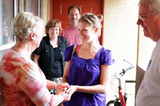 Kaitlyn Ferguson, an intern pastor from Minnesota, greets the welcoming committee when she arrives at her new apartment in Las Vegas on Friday, August 31, 2012. Ferguson will serve as an intern pastor for a year at the New Song Church in Henderson.