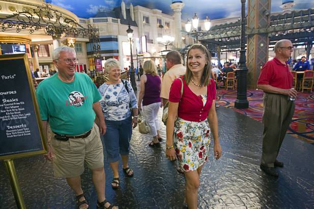 Kaitlyn Ferguson, center, an intern pastor from Minnesota, gets her first look inside a Las Vegas Strip casino during a tour with church members Vern and Annie Danielson Saturday, Sept.1, 2012. Ferguson will serve as an intern pastor for a year at the New Song Church in Henderson.