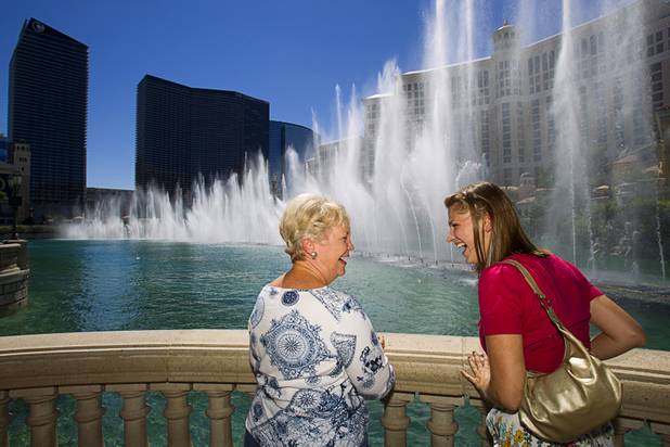 Kaitlyn Ferguson, right, an intern pastor from Minnesota, watches the fountain show with church member Annie Danielson at the Bellagio during a tour Saturday, Sept.1, 2012. Ferguson will serve as an intern pastor for a year at the New Song Church in Henderson.
