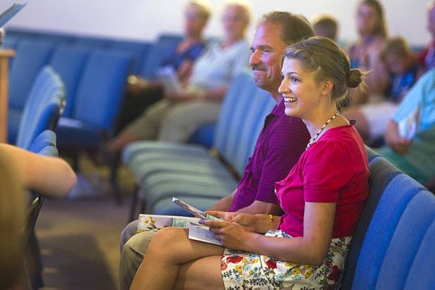 Kaitlyn Ferguson, an intern pastor from Minnesota, attends a service with her father at the New Song Church in Henderson Saturday, Sept.1, 2012. Ferguson will serve as an intern pastor for a year at the the church.