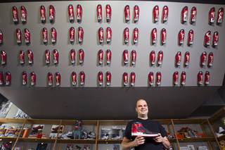 Collector Jordan Michael Geller poses in the ShoeZeum at the Neonopolis mall in downtown Las Vegas Sept.1, 2012. The collection has 2,500 pairs of new Nike shoes.