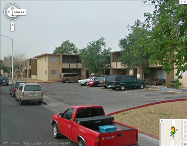 This is a screen capture from Google Street View of the apartment building where Melissa Duran was found. A red car similar to the one seen in surveillance video can be seen in the parking lot. The image is stamped May 2009.