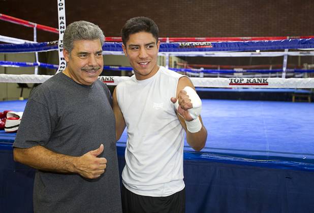 Las Vegan welterweight boxer Jessie Vargas, right poses with trainer Robert Alcazar during a workout at Top Rank Gym Tuesday Sept. 4, 2012. Vargas will fight Aron Martinez of Los Angeles at the Hard Rock Hotel on Thursday, September 13.
